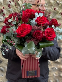 A rich red dozen roses.